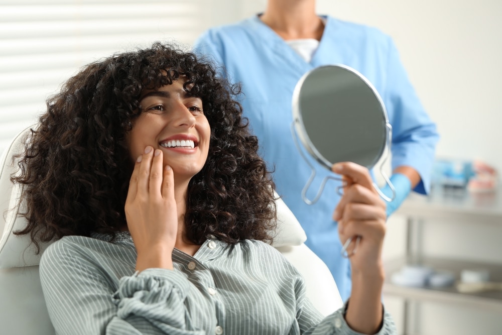 woman smiling at dentist in Etobicoke